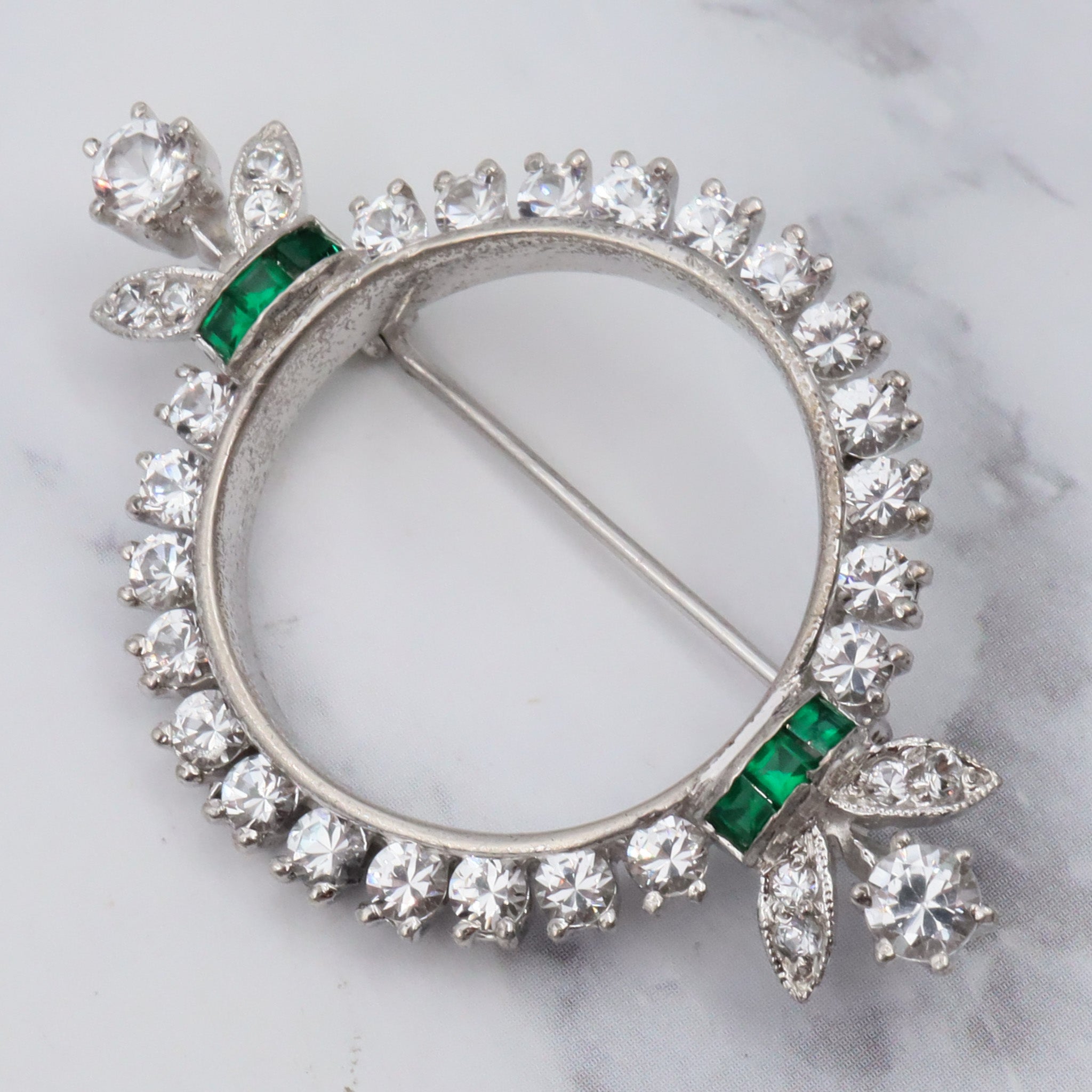 Antique Art Deco rhodium plated sterling, quartz & synthetic emerald circle frame brooch